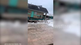 Tropical Storm Nicole: Building submerged by water after partly collapsing into the ocean