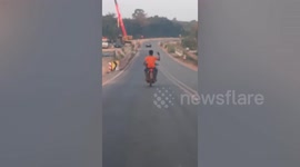 Crazed biker seen waving hands while riding arrested by police in Thailand