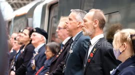 Veterans observe two-minute silence during Armistice Day Service at London's Paddington Station