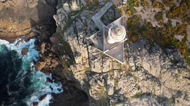 AERIAL VIEW OF A BEAUTIFUL LIGHTHOUSE IN THE ATLANTIC - 4K DRON