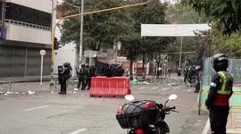 Police tank is attacked by protesters. For several days there have been protests over the increase in rapes of women on Transmilenio buses, Bogotá's transportation system.