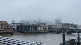 City of London skyline disappears in thick fog