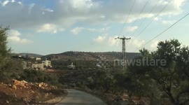 Palestinian students attend a lesson into a school in the Yanun village