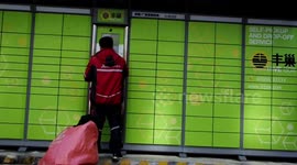 A Courier Express Delivers Packages To A Smart Express Cabinet in Yichang, China