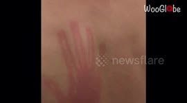 Guy imprints his hand on bandmate's back with a tight slap