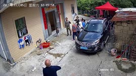 Tiles strike man's back after falling off house in China