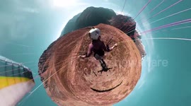 Speedflyer skims treetops and rocks during descent down Austrian Alps