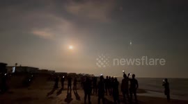 Rocket Artemis I flying over Cocoa Beach, FL, USA
