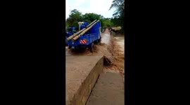 A Kenya Power truck crossing a flooded river in remote part of Kenya