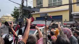 Riot police fight back against protesters as they attack squad car in Thailand