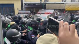 Riot police charge at protesters during rally against APEC summit in Bangkok