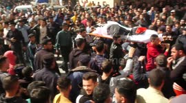 Mourners attend the funeral of 21 Palestinians who died a day earlier, when fire broke out in an apartment in the Jabalia refugee camp in the northern Gaza strip