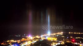 Reflections from ice crystals in the air create 'light pillars' above Chinese city