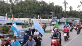 A convoy of vehicles carrying the flags of the world cup contesting countries by residents of Jayapura City ahead of the opening of the 2022 world cup.