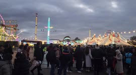 Winter Wonderland guests still piling in ad dusk sets. Hyde Park.