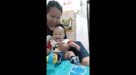 The sound of the laughter of a five-month-old baby while playing with his mother in Indonesia