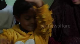 Palestinian family of Jarour suffer from diabetes, sit at their home on International Children's Day