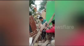 Residents panic during an earthquake Residents are evacuated from collapsed buildings