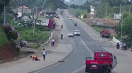 Rider and pillion knocked from motorcycle when stray dog darts across road