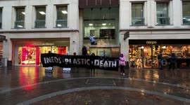 Extinction Rebellion activists set off flares atop INEOS office in London