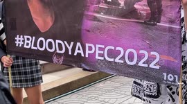 Anti-government protesters gather to condemn police violence at APEC summit in Thailand