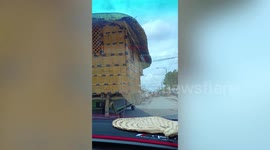 Resourceful driver fits house on the back of truck in the Philippines
