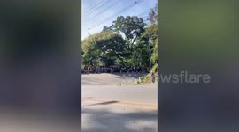 Energetic students run uphill in welcome ceremony at Thai university