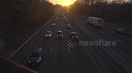 Busy highway I-95 day before Thanksgiving Day with evening sunset.It was one from busies day for travelers. This is view near to Exit 14