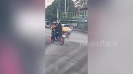 Loyal pet dog chases owners leaving on motorcycle