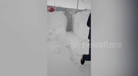 Chinese man wake up to find his home buried under snow