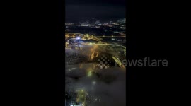 Night View of City Landmark Surrounded by Clouds in Nanning, China