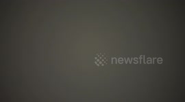 A very strong lightning flash followed by a deafening thunder clap during a storm in Thailand.