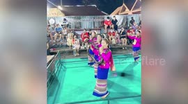 Thai women bizarrely dance with live cobras inside their mouths