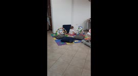 Baby in a world of its own, oblivious to being recorded, sitting amongst toys blowing raspberries, chatting away lost in the moment until the end when she turns her head and realises - her laugh/giggle at the end of the video is worth the wait!