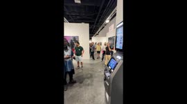 ATM Displays Account Balance and Photo at Art Basel (Vertical video)