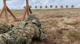 Female British Army recruit firing gun in cold conditions, very cold in Sennybridge training area