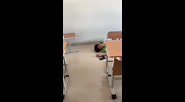 Heavy-sleeping student unbothered as classmates attempt to wake him
