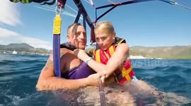 Terrifying moment couple's parasail gets entangled with another - sending them crashing into the sea off the coast of Turkey
