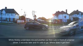 Car dangerously undertakes at a right turn, pulling out in front of a learner.