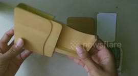 Burmese craftsman makes creative wooden wallets for a living