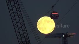 December Full Moon, AKA Cold Moon, rises by Thames cable car in London