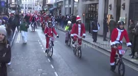 Dozens of Santa bikers ride through Soho, London