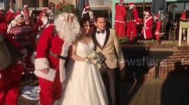 Santas join couple's wedding photo moment in London