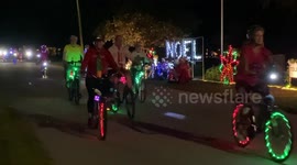 Hundreds of riders on brightly lit bikes take part in 'holiday glow ride' in Venice, Florida