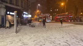 Londoners playing in the snow on Sunday night when it started to snow at Victoria