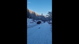 Car skids out of control after Arctic blast hits the UK