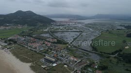 Flying over and near impressive cliffs in Laredo at sunset with danger by drone