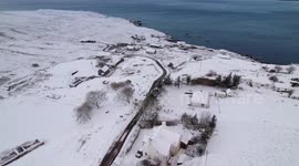 Fresh Snow in Elgol, Isle of Skye. Captured by drone looking towards Rum