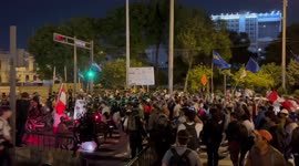Police attempt to stop protesters marching through Lima. Protesters break past police