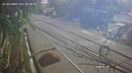 Two girls have near miss walking along bridge moments before out-of-control truck overturns